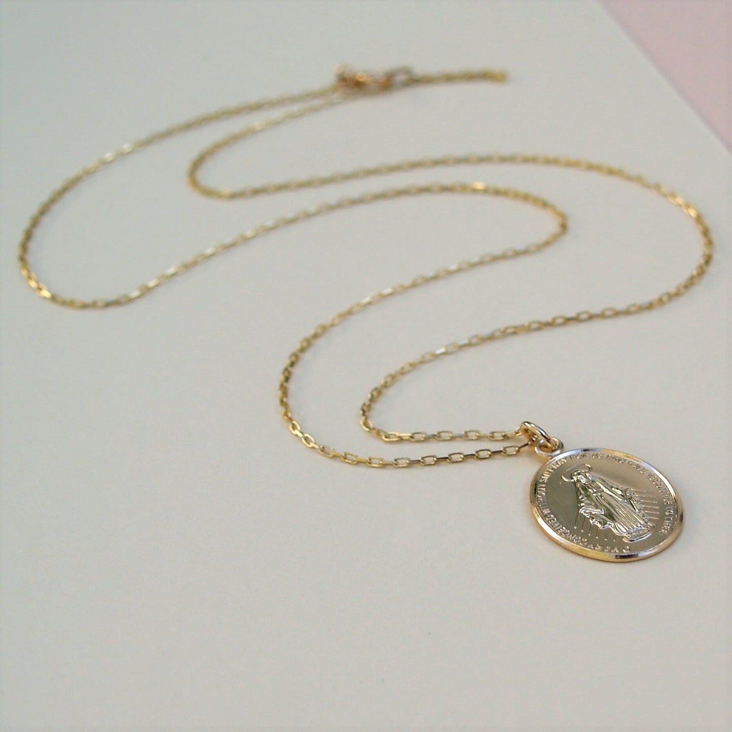 9ct solid yellow gold large size Miraculous Mary medal pendant on a 1.1mm wide diamond cut trace chain