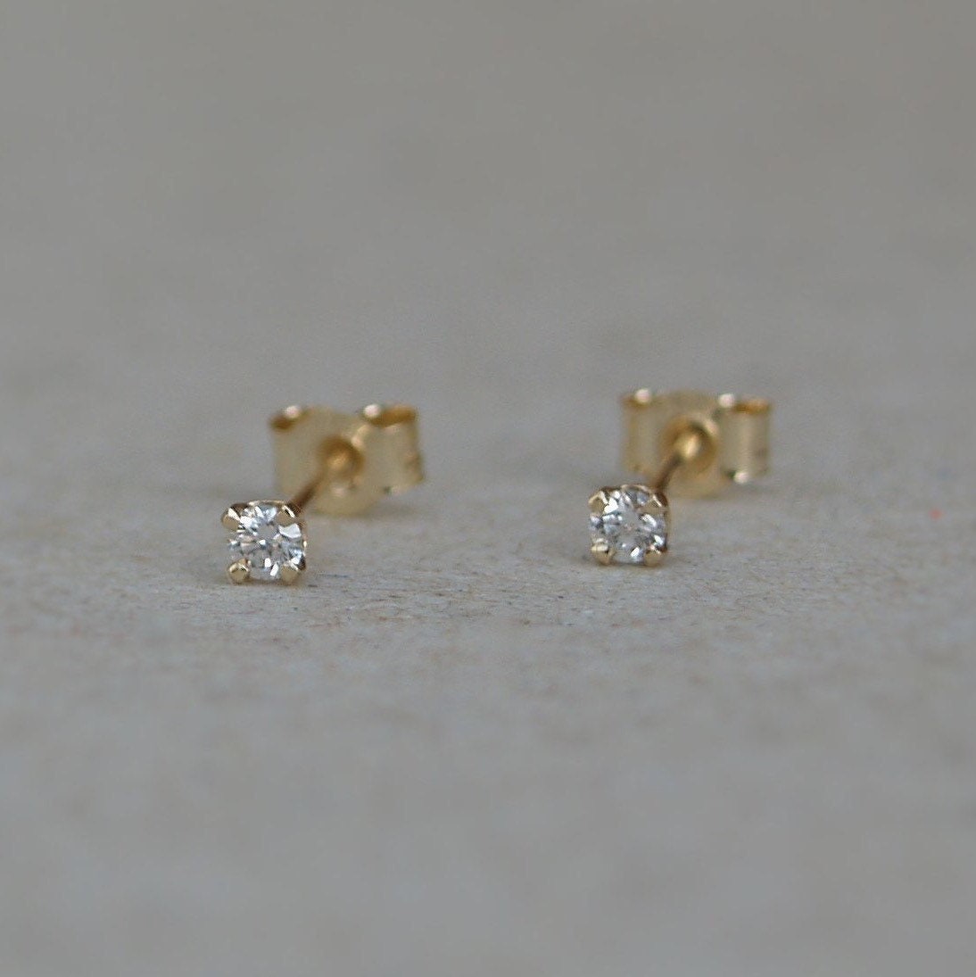 9ct yellow gold tiny 2.mm diamond claw set stud earrings