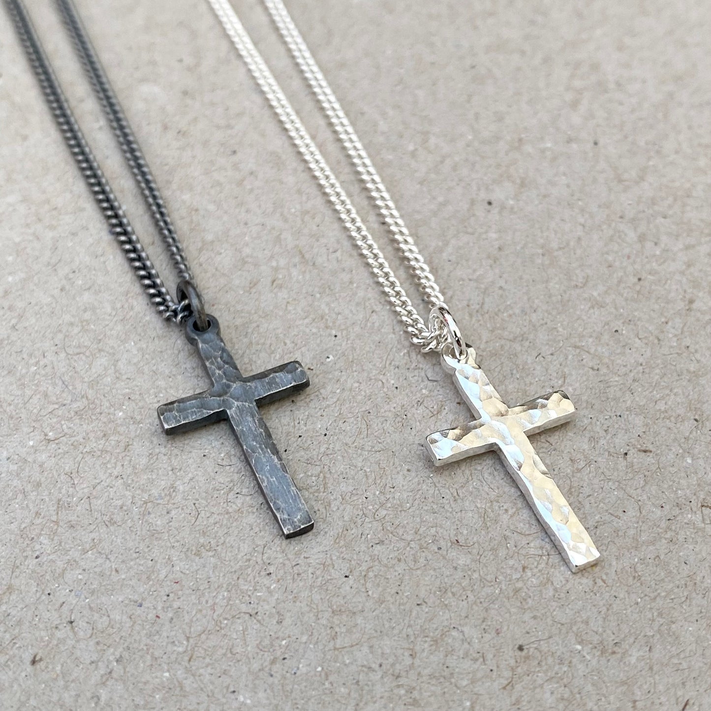 Oxidised or polished small size solid silver hammered cross pendant on a 1.8mm wide tight curb chain
