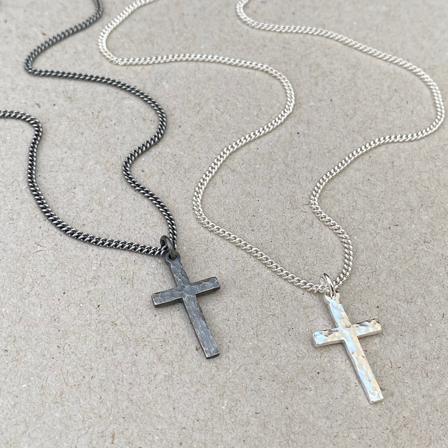 Oxidised or polished small size solid silver hammered cross pendant on a 1.8mm wide tight curb chain
